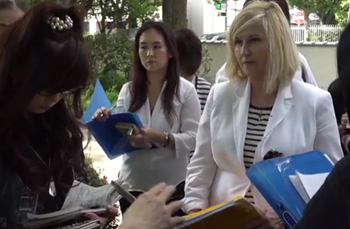 Kelly Hampton, energy healer, with students in Tokyo