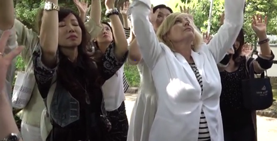 Kelly Hampton and students at Japan's Tree of Knowledge