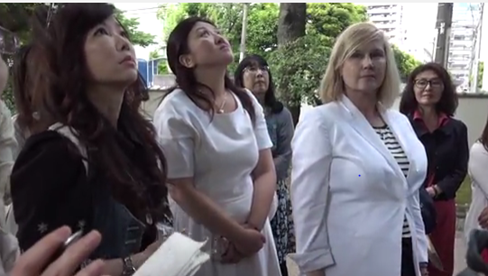 Kelly Hampton at Japan's Tree of Knowledge with students